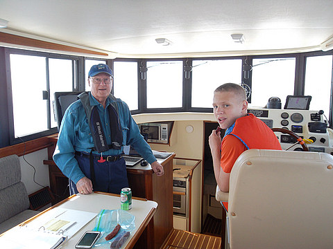 Connor at the Helm with Grandpa